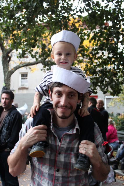 Man with child on shoulders