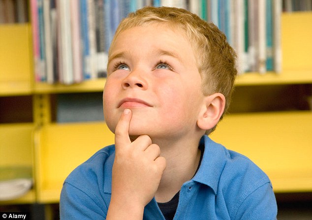 Boy thinking in library
